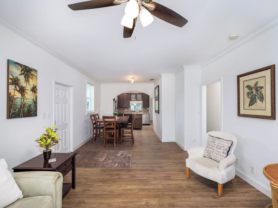 Settle into this bright open layout connecting the living and dining areas, complete with lovely warm accents and the perfect backdrop for your vacation