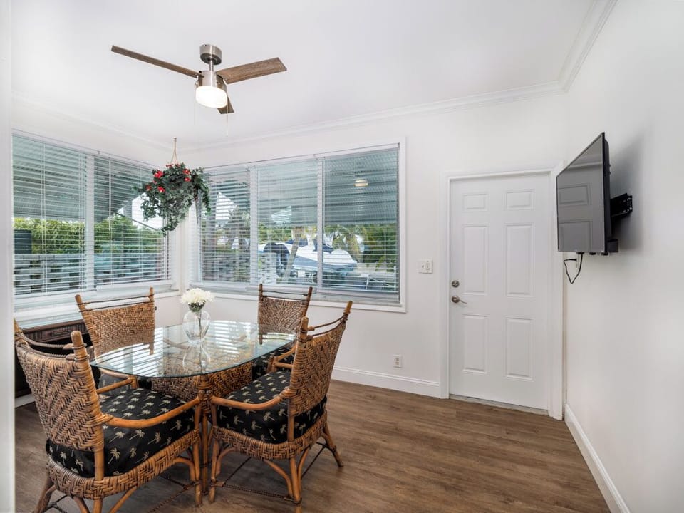 Gather for a meal in this inviting dining space, offering charming tropical details, comfortable seating, and the perfect backdrop for your vacation.
