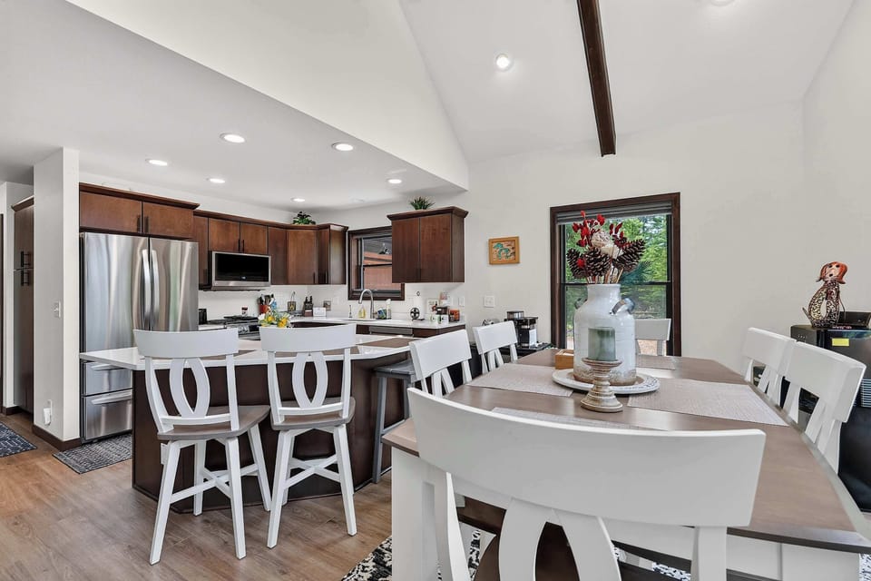 Bar top seating for 6 at the main table. 3 breakfast bar seats