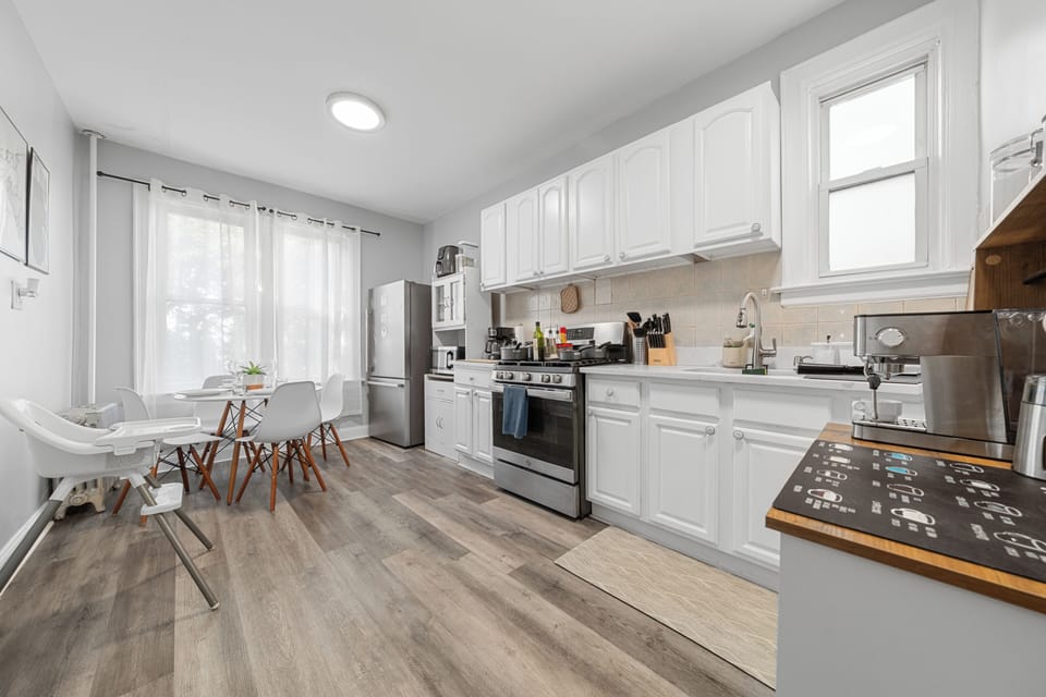 Bright modern kitchen with dining nook, natural light, and family-friendly touches