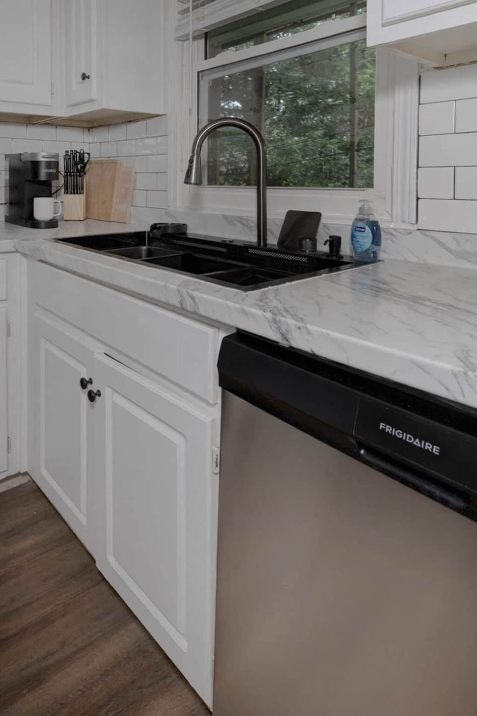 Dishwasher and deep workstation sink — zero-hassle cleanup on longer stays
