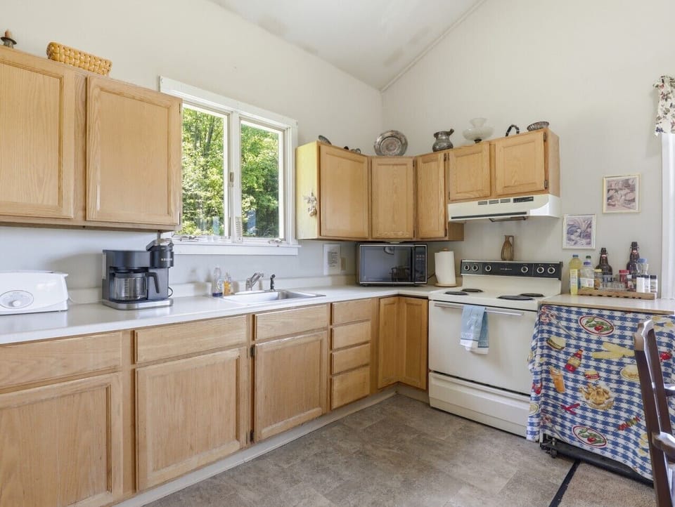 Kitchen | Electric Range & Microwave | Coffee Maker & Window Views