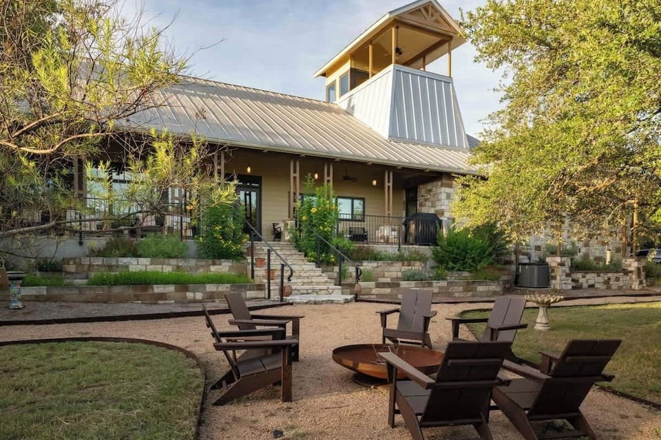 Gather around the fire pit under big Texas skies. Surrounded by Adirondack chairs, this charming outdoor space is perfect for roasting s’mores, stargazing, or enjoying Hill Country evenings with friends beneath the silhouette of your observation deck