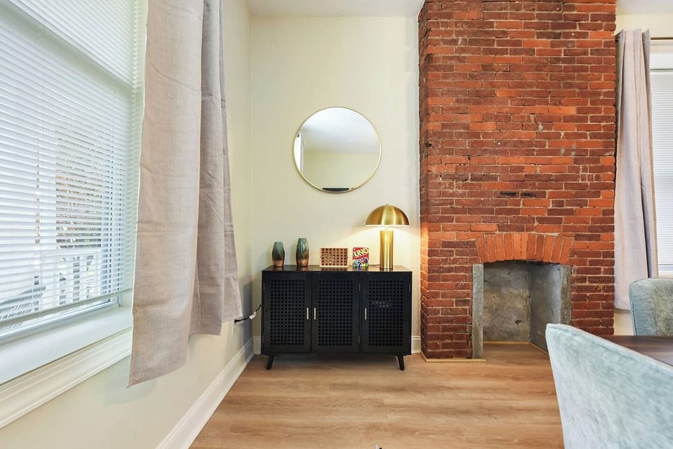 Stylish dining area with exposed brick accents and ambient lighting for a cozy atmosphere