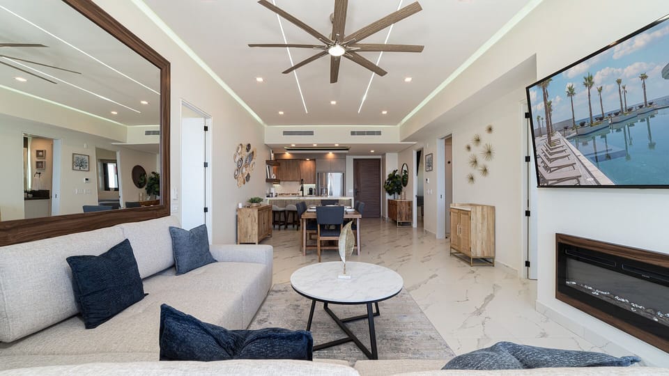 Living room features an electric fireplace