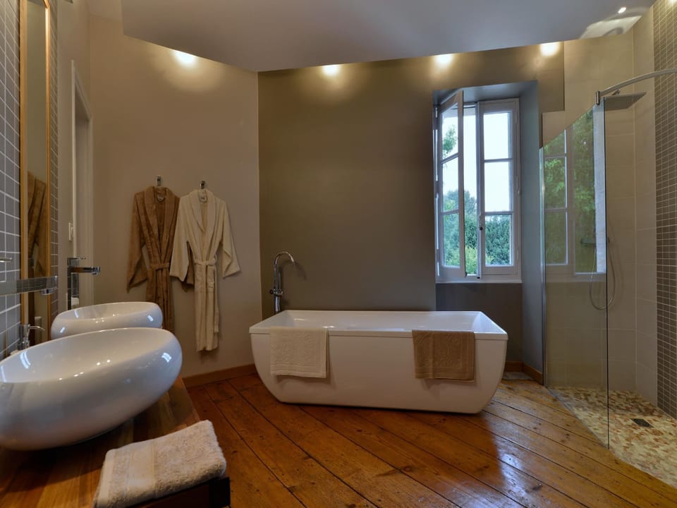 Exclusive Suite, Ensuite, Garden View (La Bordelaise) | Bathroom | Rainfall showerhead, free toiletries, hair dryer, bathrobes