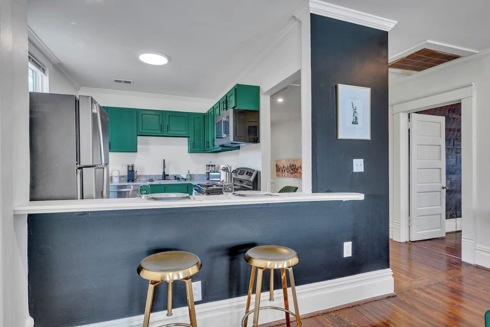 The breakfast bar keeps everyone connected, whether you're sipping coffee, helping with dinner, or chatting with the cook. Two bar stools provide the perfect spot for a quick bite or morning coffee.