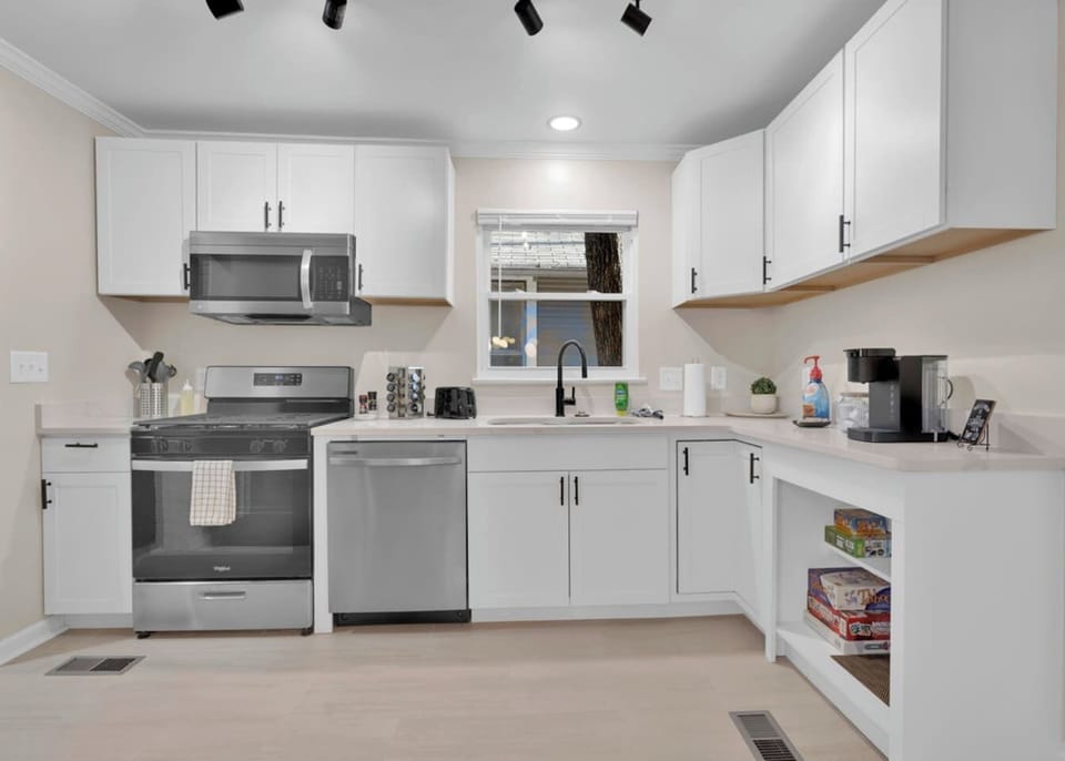 Whether you're brewing your first cup of coffee or preparing a family favorite, this bright, modern kitchen makes gathering around good food feel effortless.