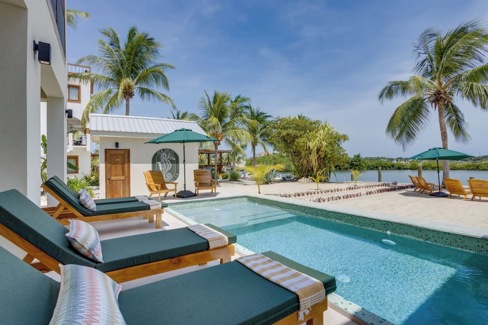 Pool with loungers and view of the lagoon