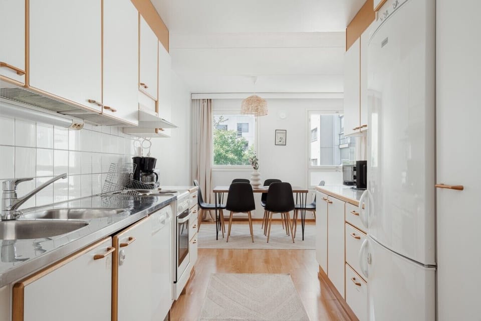 Galley kitchen with a view through to the dining area