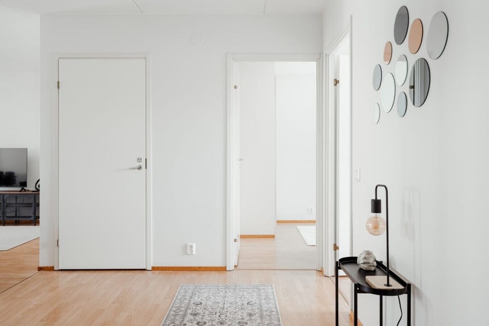 Bright hallway leading to the bedrooms with a console table