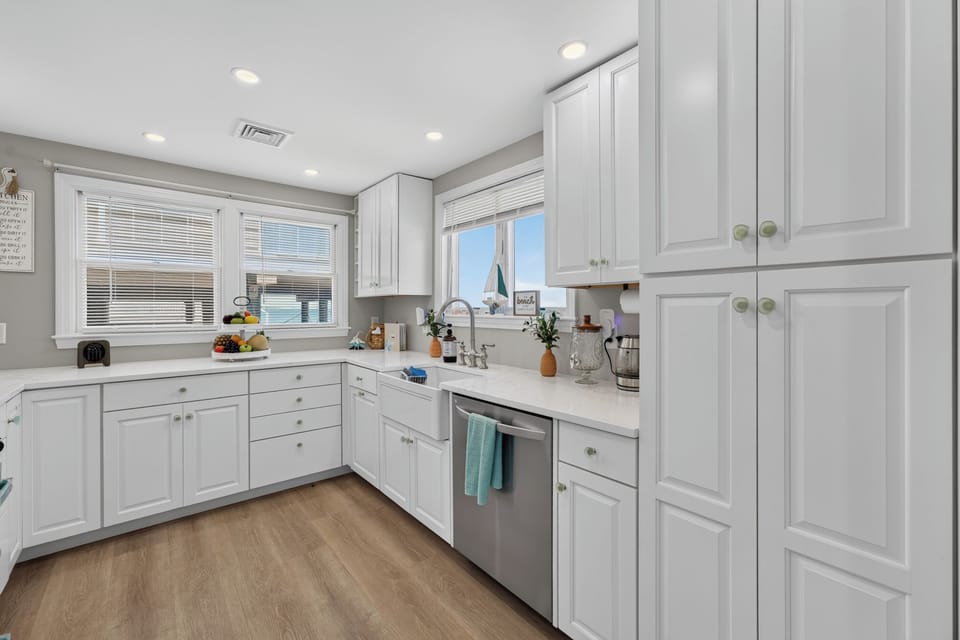 A bright, spacious kitchen with plenty of cabinetry and counter space for preparing meals.