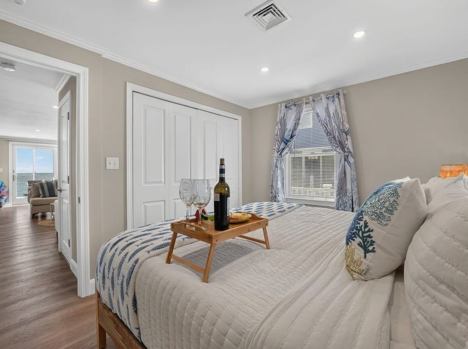 A cozy, inviting bedroom designed for restful nights after a day by the ocean.
