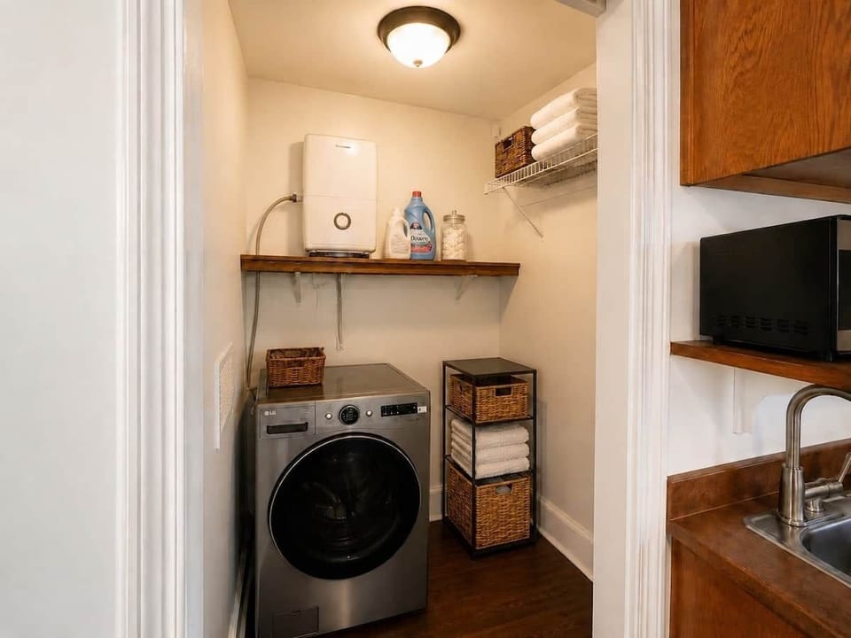 Washer-dryer combo and kitchenette in Chef’s Château Suite A