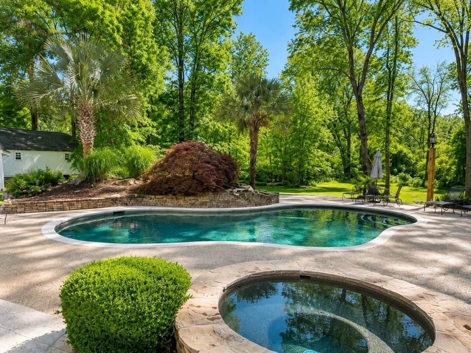 Landscaped shared pool and lounge area at Chef’s Château