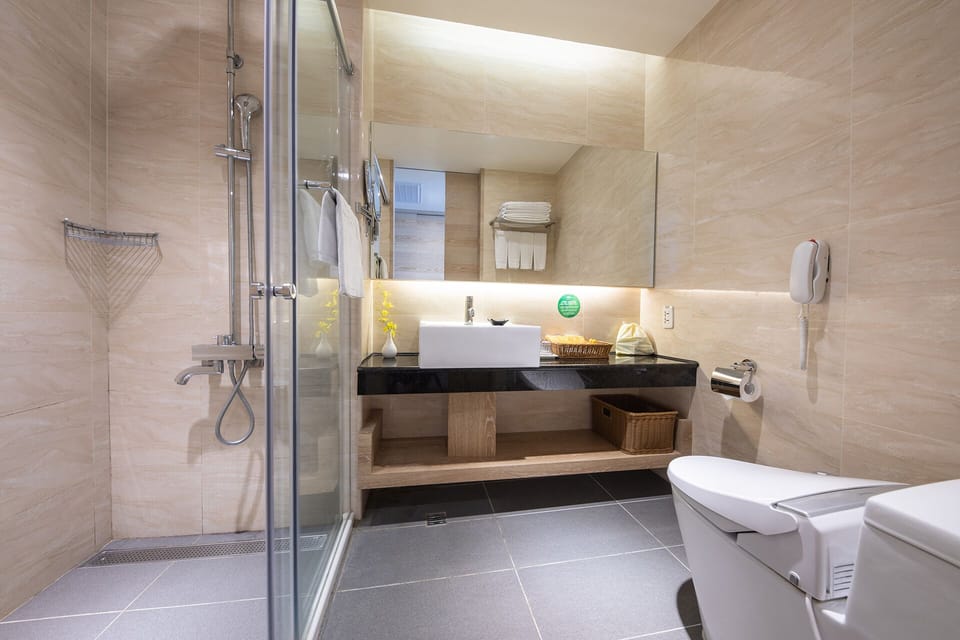 Shower, slippers, bidet, towels