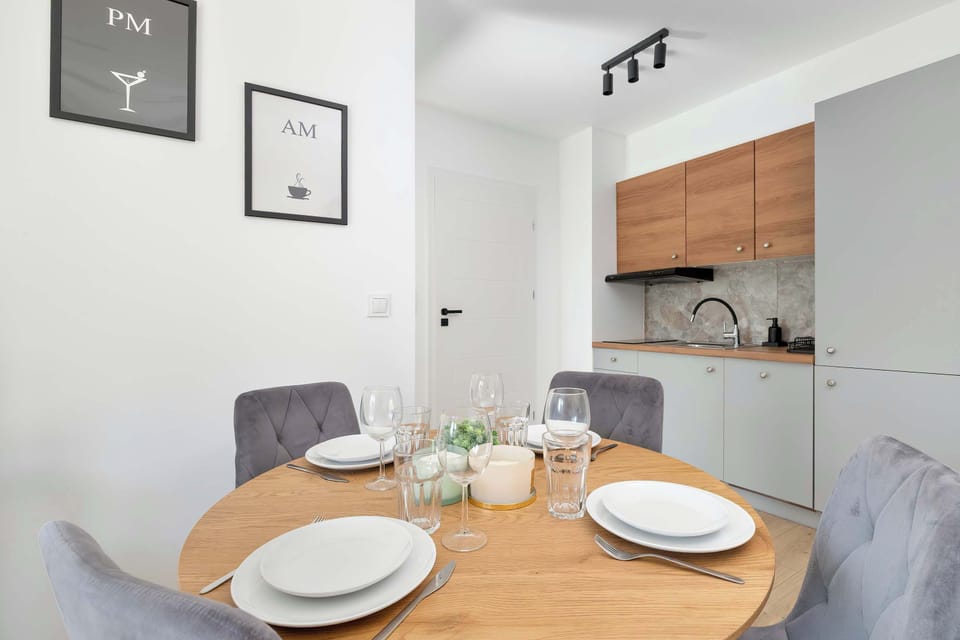 The sleek design of the kitchenette blending seamlessly with the living area.