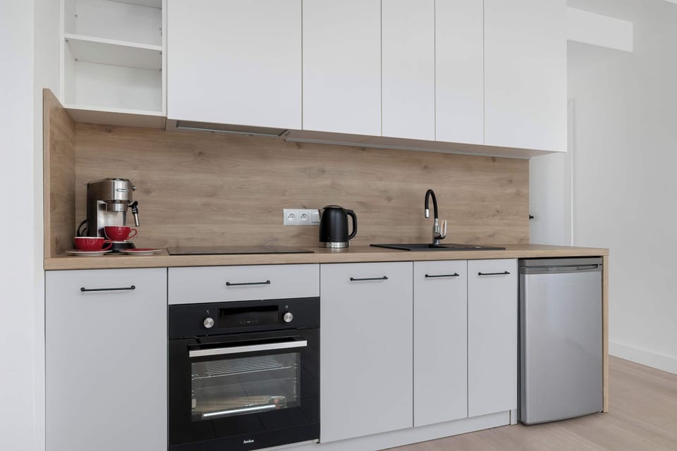 The fully equipped kitchenette includes everything you need for a home-cooked meal.