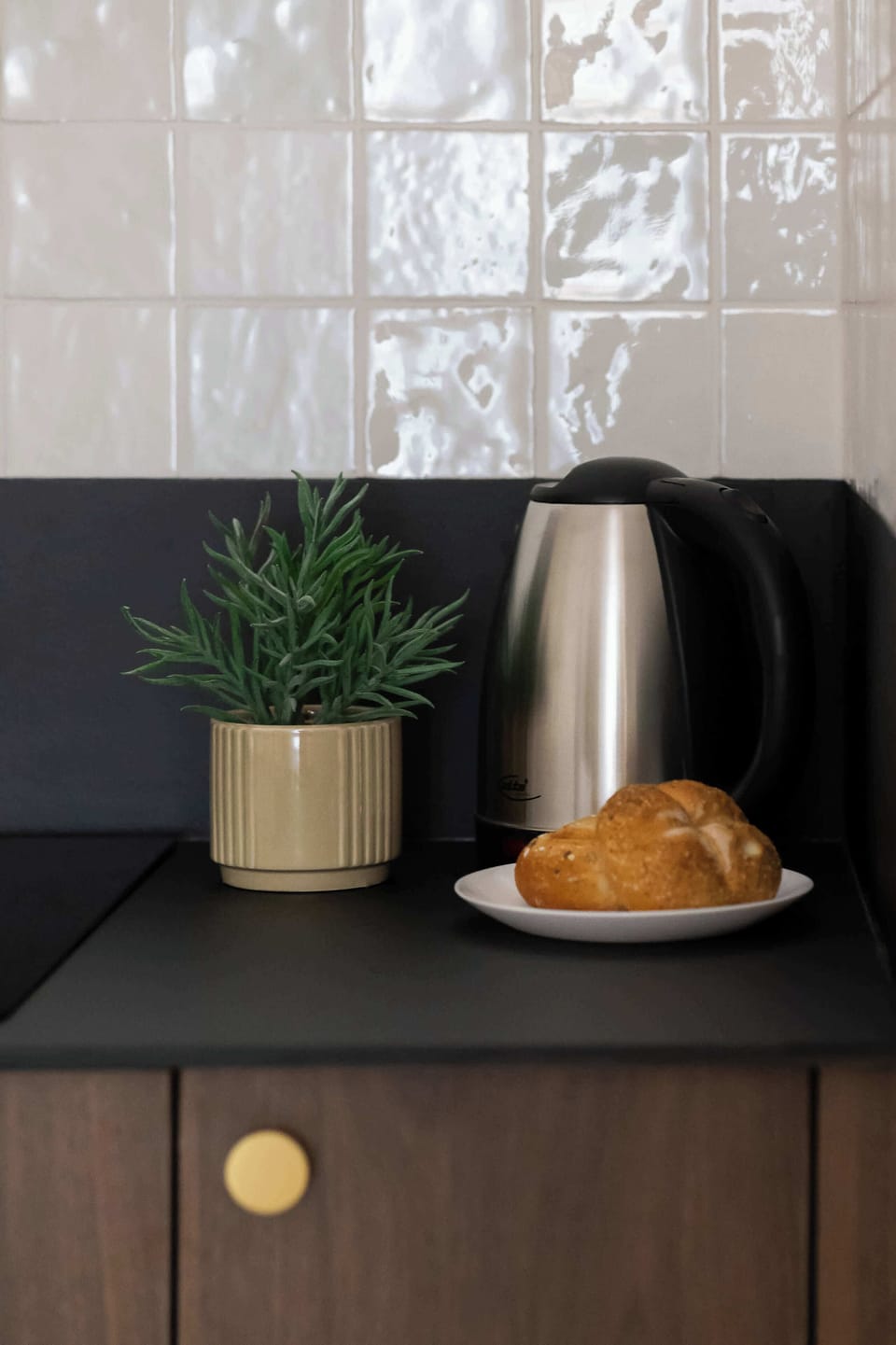 The fully equipped kitchenette includes everything you need for a home-cooked meal.
