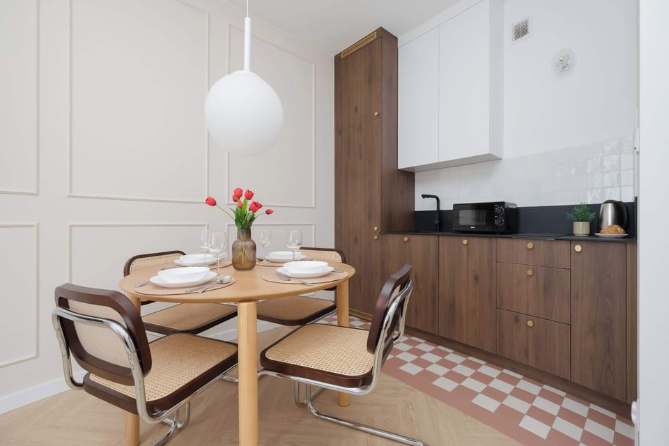 The sleek design of the kitchenette blending seamlessly with the living area.