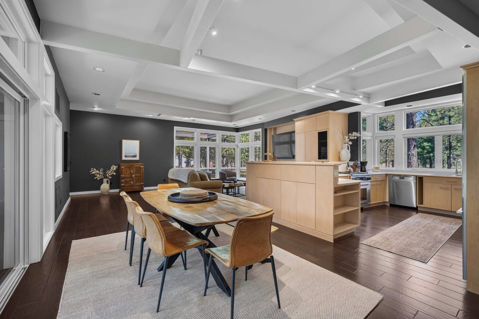 Sunlight fills this open-concept space where you'll gather for meals at the handsome live-edge table, then relax in the living area. Your fully equipped kitchen flows seamlessly into every moment of your stay.