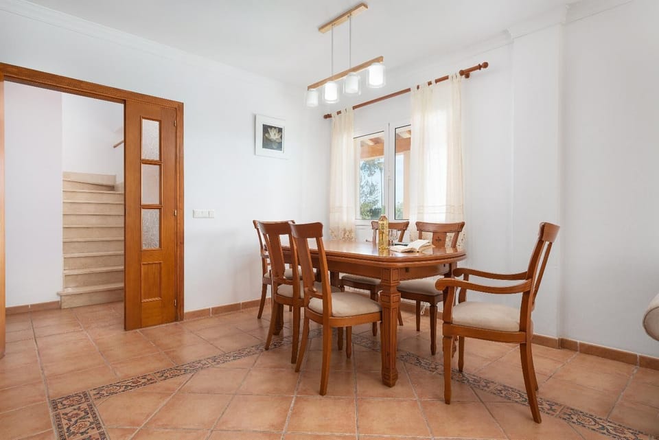 Living room with sofas, dining area, ornamental fireplace, WiFi internet, and satellite TV