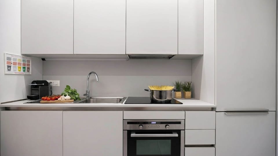 Apartment (2 Bedrooms) | Private kitchen | Espresso maker, microwave, electric kettle, highchair