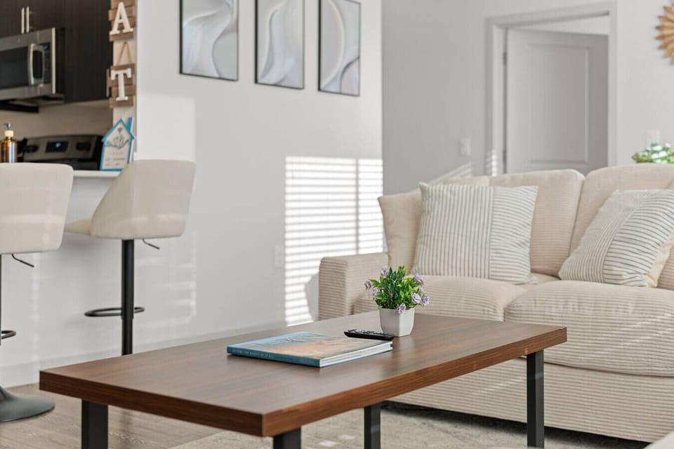 Inviting open-plan living room with plush seating and tasteful accents.