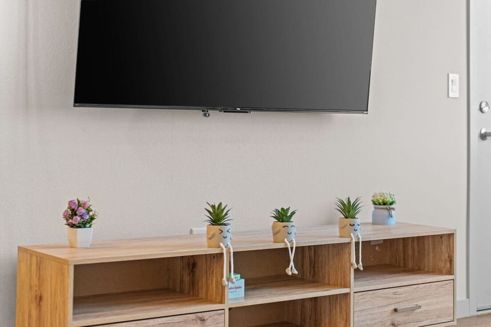Enjoy your favorite shows and movies on the wall-mounted TV.