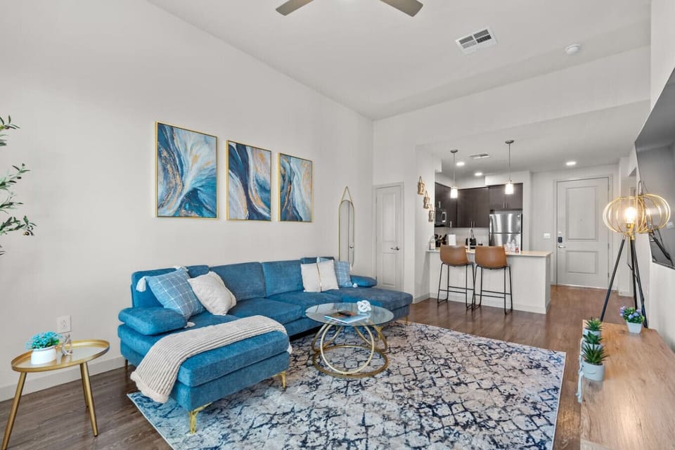 Relax on the plush blue sectional and enjoy a movie on the large-screen TV.