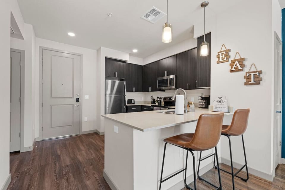 Enjoy casual meals and conversation at the kitchen breakfast bar.