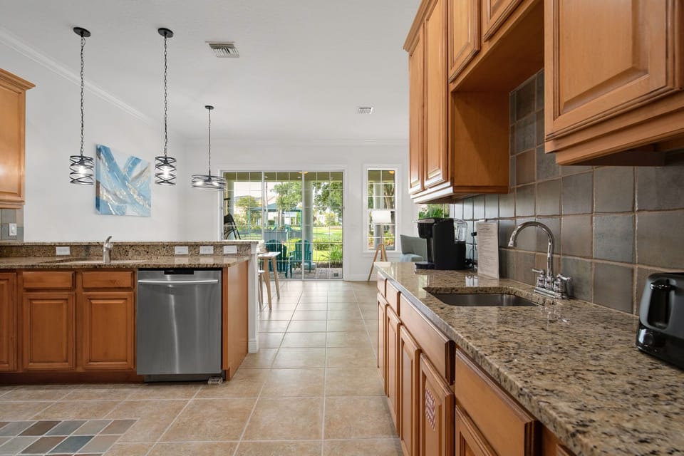 Enjoy the bright open-concept kitchen with stainless steel appliances, plenty of counter space, and a functional layout that keeps everyone connected.