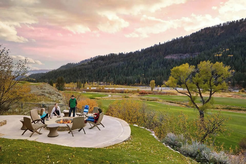Around the fire pit as the sun drops behind the Tetons — evenings here tend to stretch long