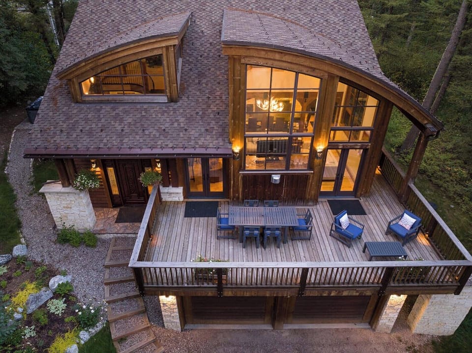 The wrap-around deck connects directly to the great room below.