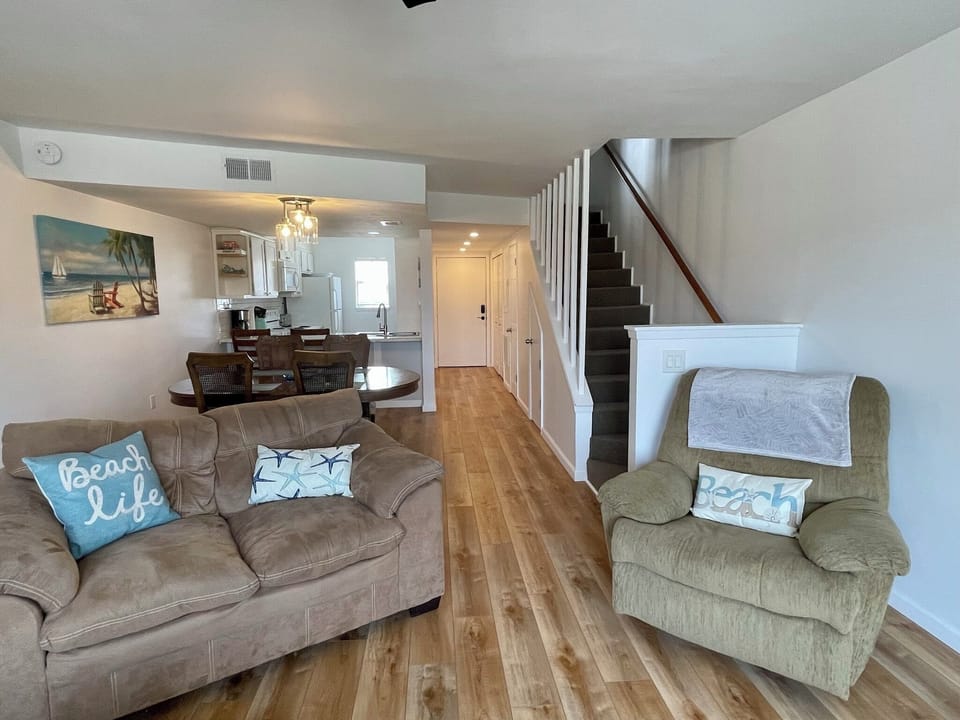 Living/Dining area with stairs leading up to the bedrooms
