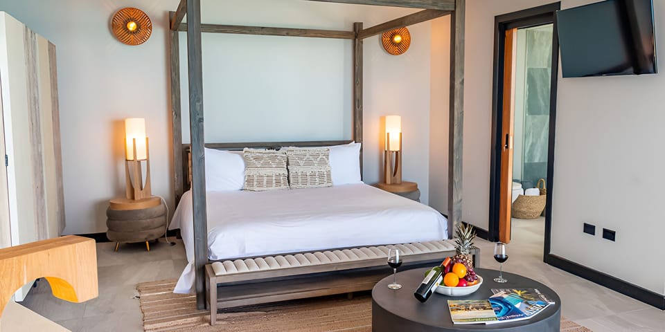 Drift into comfort in a stylish canopy bed retreat.