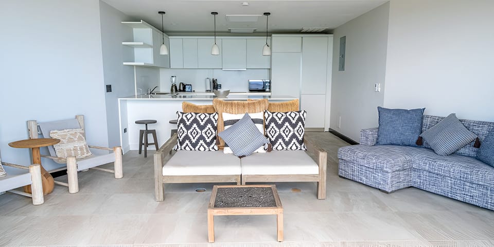 Gather in the airy living room steps from the kitchen.