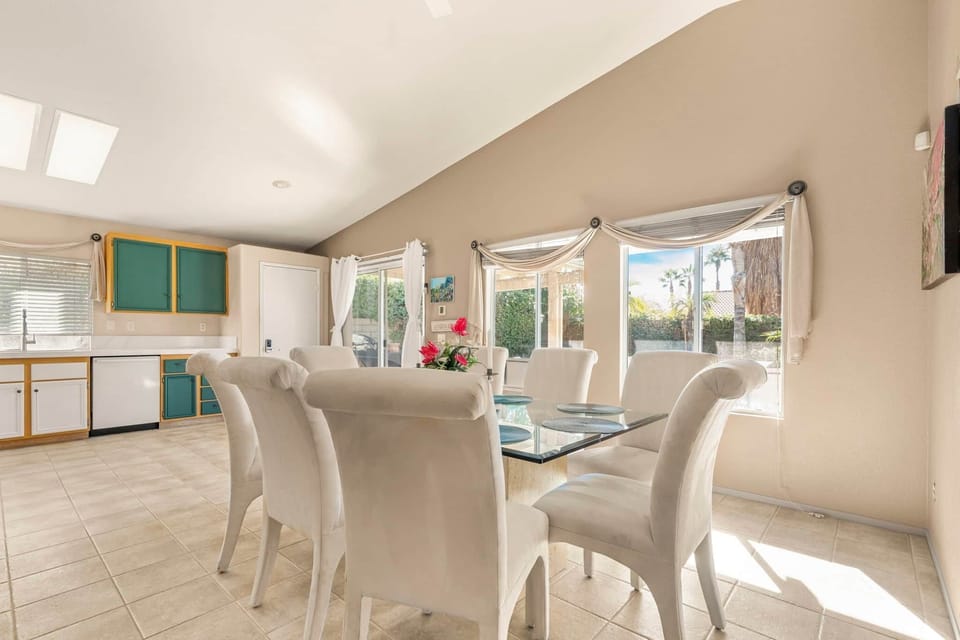 Step into this sun-drenched, inviting dining space, perfectly situated adjacent to kitchen & pool