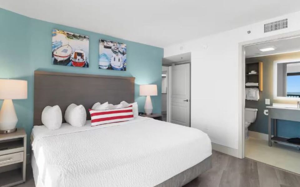 Unwind in crisp linens after a sun-soaked beach day.
