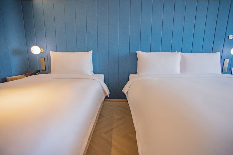 Family Triple Room, Non Smoking | Down comforters, memory foam beds, minibar (free items), desk