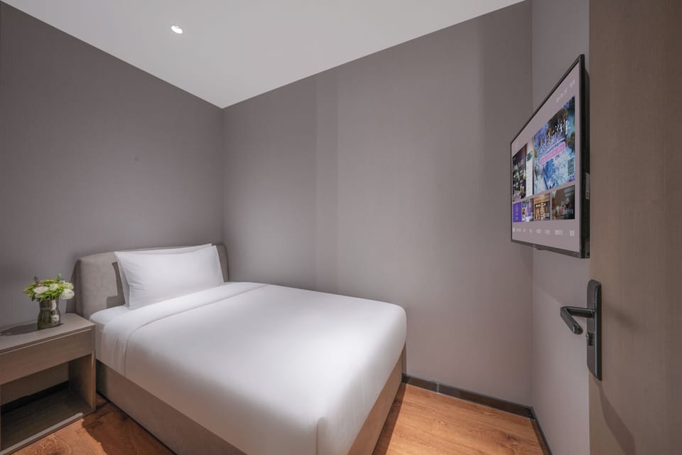 Family Triple Room | Living area | 65-inch LCD TV with cable channels, pay movies, printers