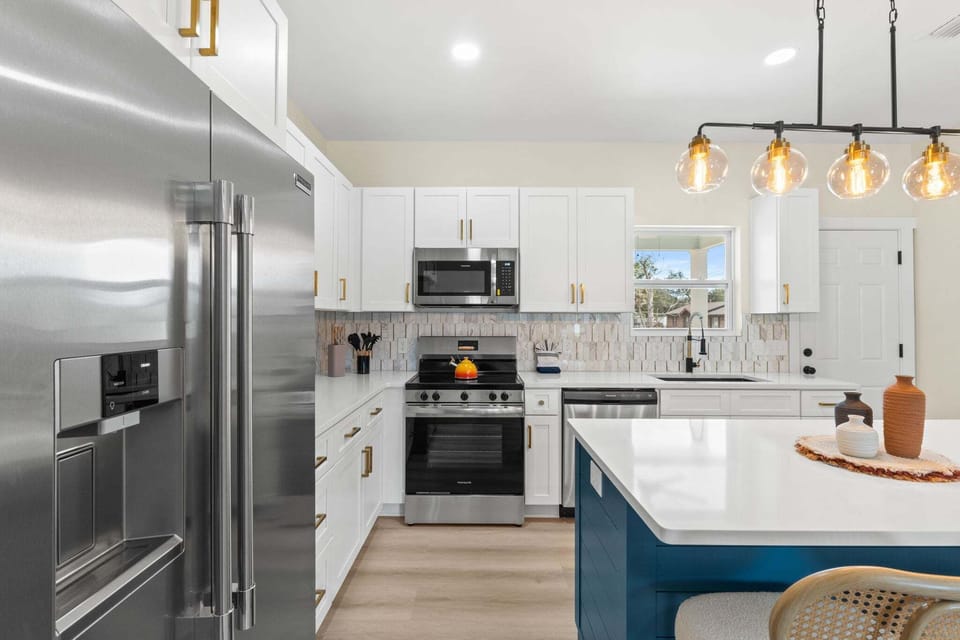The kitchen in this new construction home features brand‑new appliances that give the space a fresh, modern feel.