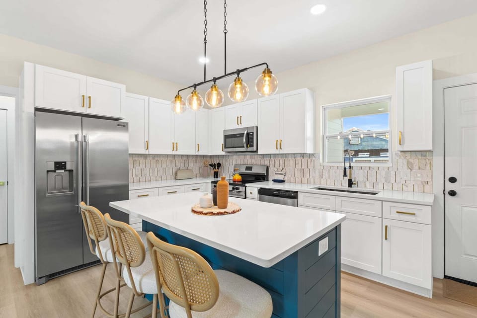 An eat‑in island provides extra seating and a perfect spot for casual meals or conversation.