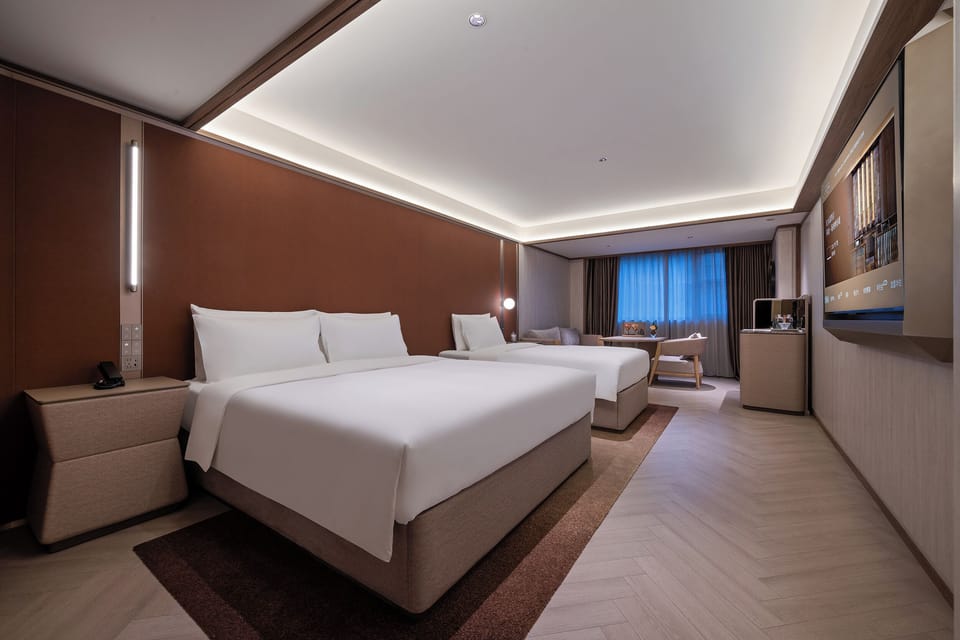 Family Triple Room | Down comforters, minibar (free items), desk, laptop workspace