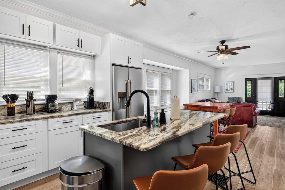 Kitchen: Prepare everything from quick breakfasts to family dinners in this fully equipped kitchen featuring modern appliances, ample counter space, and essential cookware.