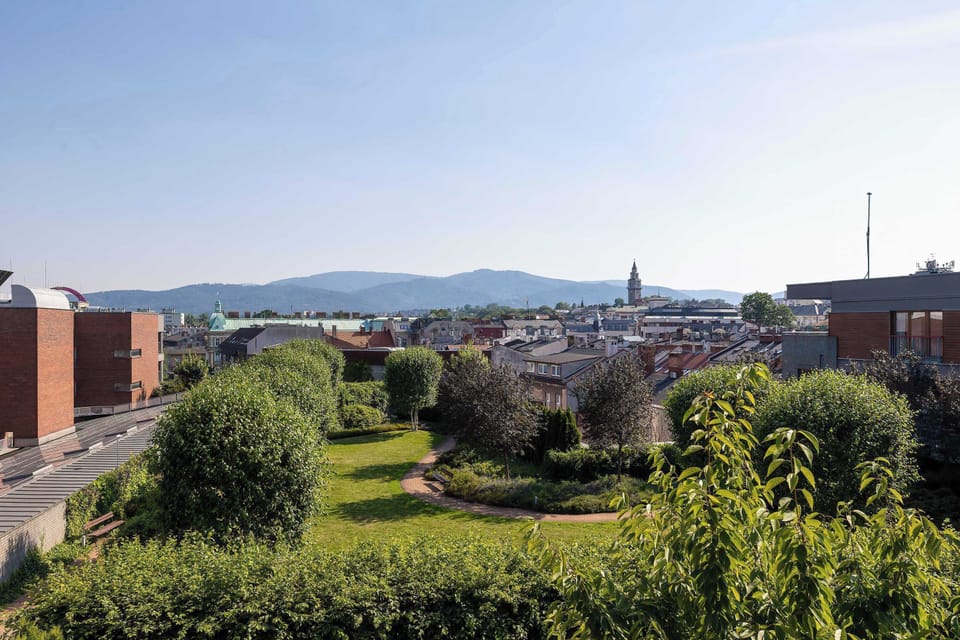 A panoramic view over the city and surrounding hills. The scenery is especially beautiful at sunset.