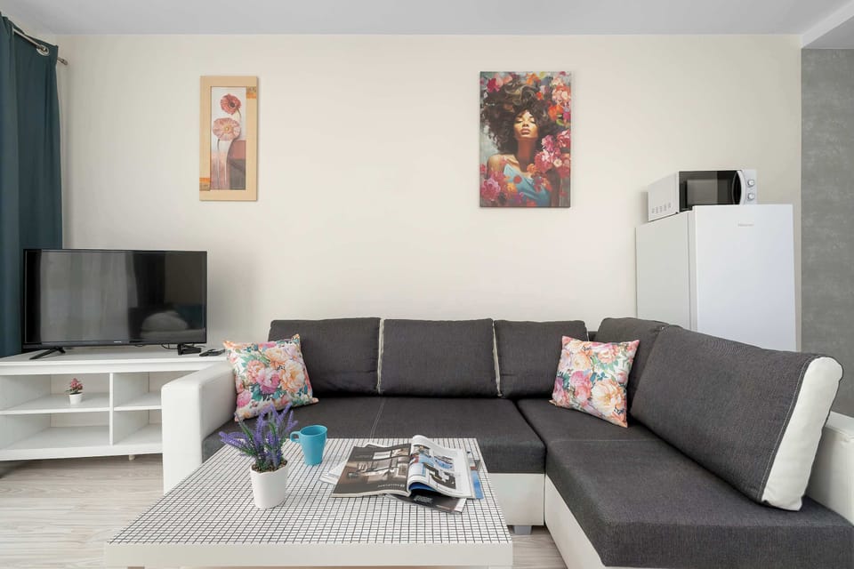 A cozy lounge area with a sofa, coffee table, and tasteful décor. It's a welcoming space to relax after a day of sightseeing.
