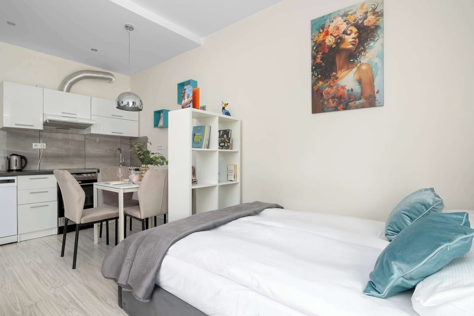 A stylish open-plan studio combining the sleeping area and kitchenette. The smart layout creates a spacious and comfortable atmosphere.