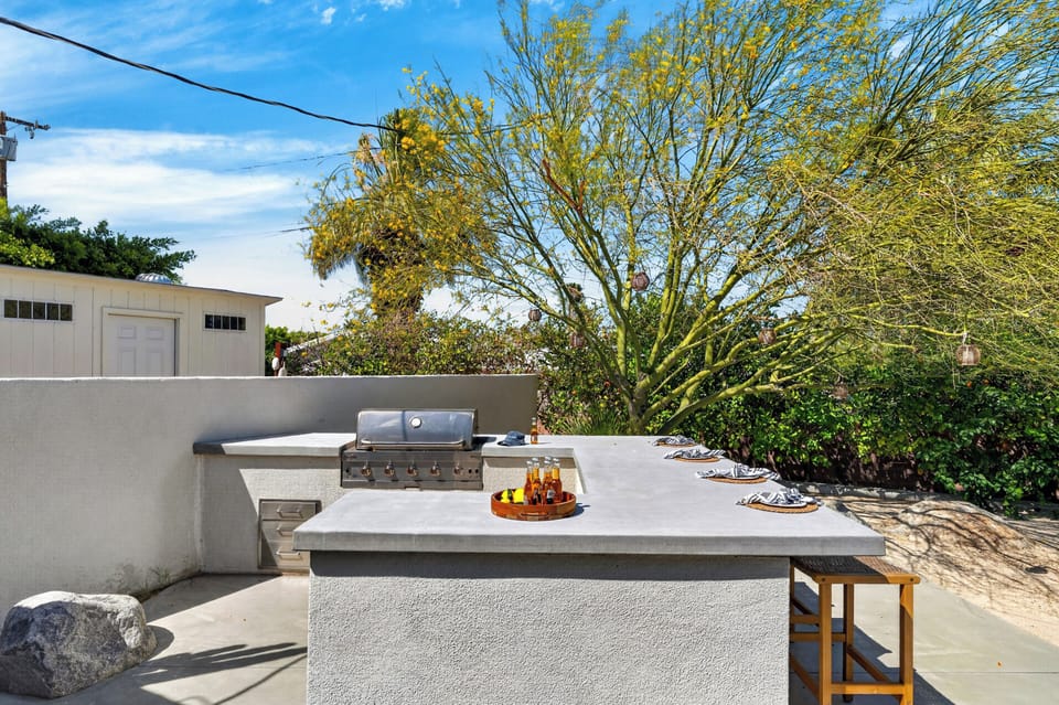 Built-in outdoor kitchen and bar station.