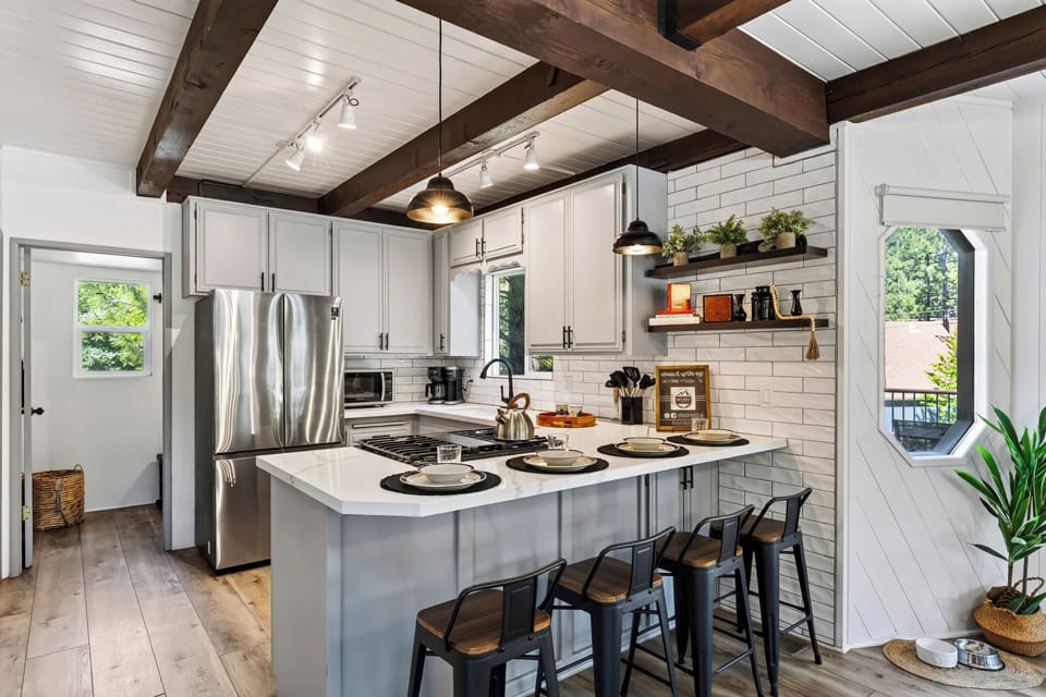 The pet-friendly kitchen includes a dedicated food and water station, so four-legged guests feel right at home.